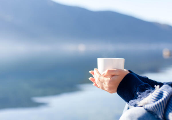 Winter Picnic. Woman Drinks Coffee At Sea Beach. Girl Enjoying C