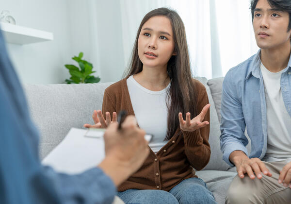 Couple Support Each While Discussing Family Issues With Psychiat